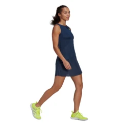 Adidas Women's Primeblue Dress (Navy/Yellow) -Racquet Guys Sports GH7599 APP on model walking white