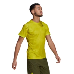 Adidas Men's FreeLift Primeblue Printed Top (Yellow) -Racquet Guys Sports GQ2221 APP on model walking white