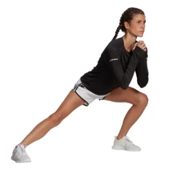 Adidas Women's Marathon 4-Inch Shorts (White/Black) 9 Adidas Women's Marathon 4-Inch Shorts (White/Black) -Racquet Guys Sports GQ9348 APP on model walking white eeb2e405 9074 49f3 ab97 0d132973d440